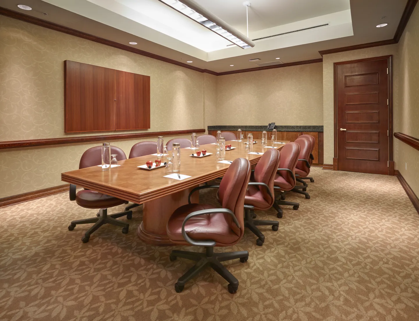 A hotel boardroom with warm furnishings