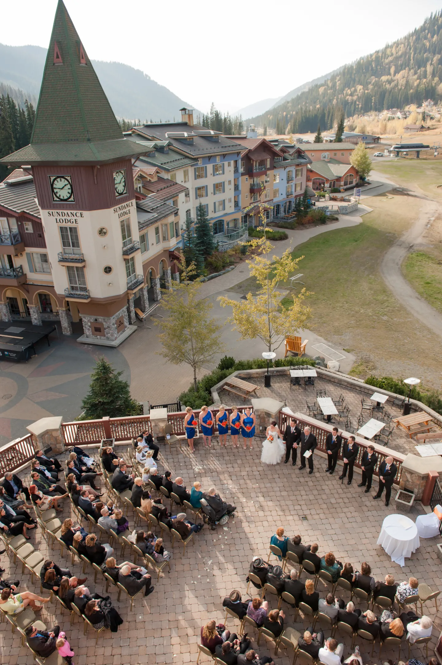 An aerial view of a wedding ceremony on a resort hotel patio