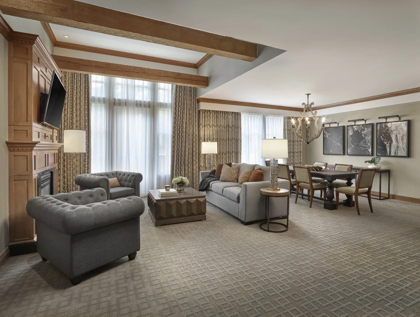 Vaulted ceilings welcome you to the great room, featuring fireplace, Juliette balcony, and dining area with harvest table