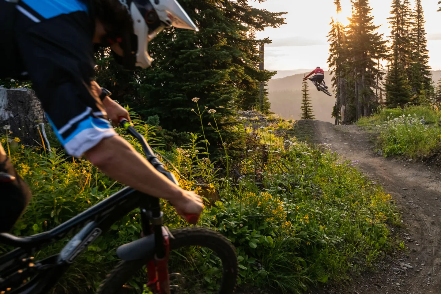 Biker going over a jump in Sun Peaks Resort bike park
