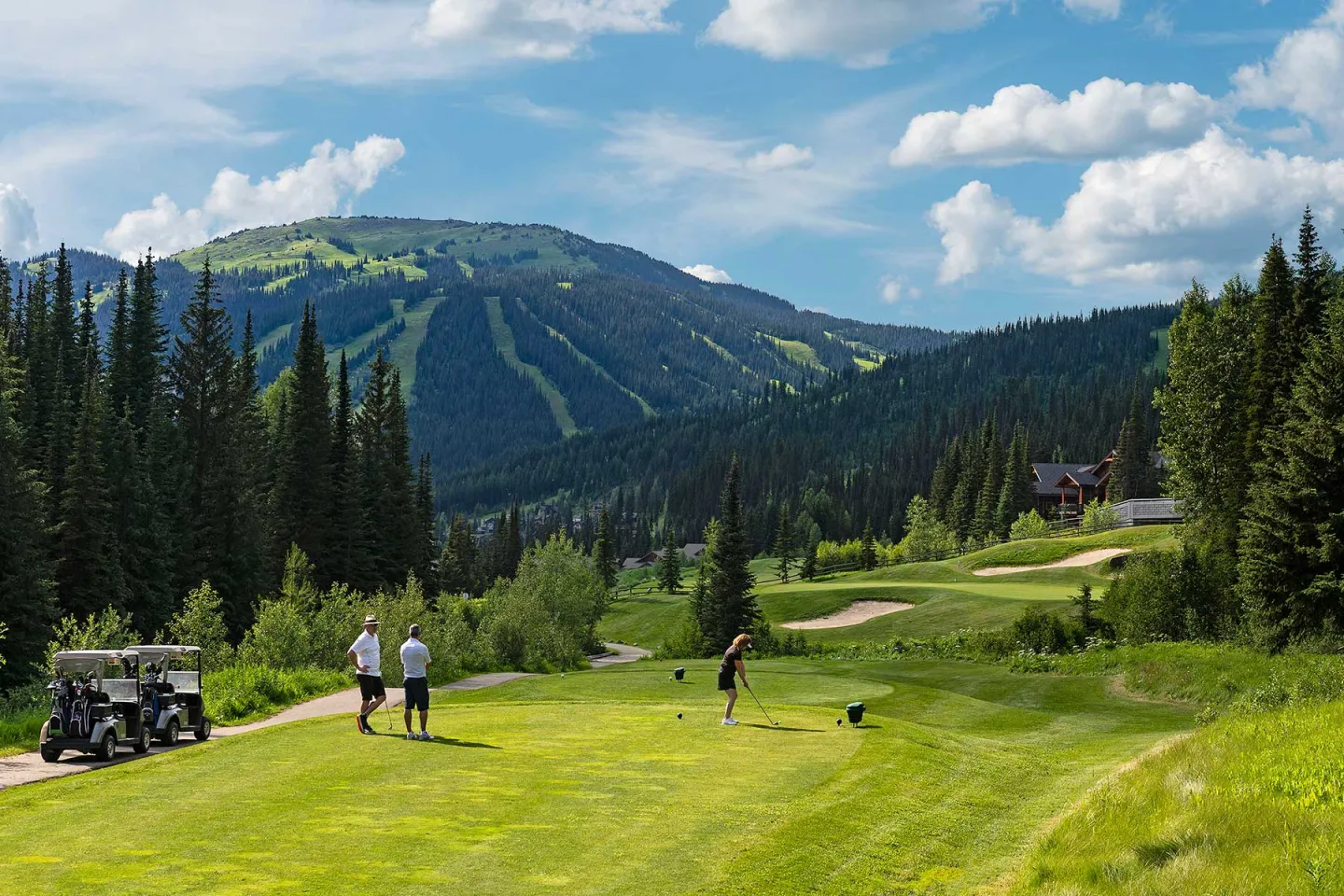 Women teeing off at Sun Peaks gold course