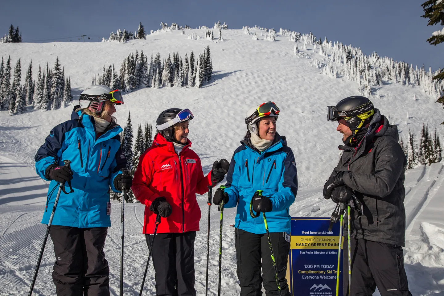 Group of skiers standing with Nancy Greene