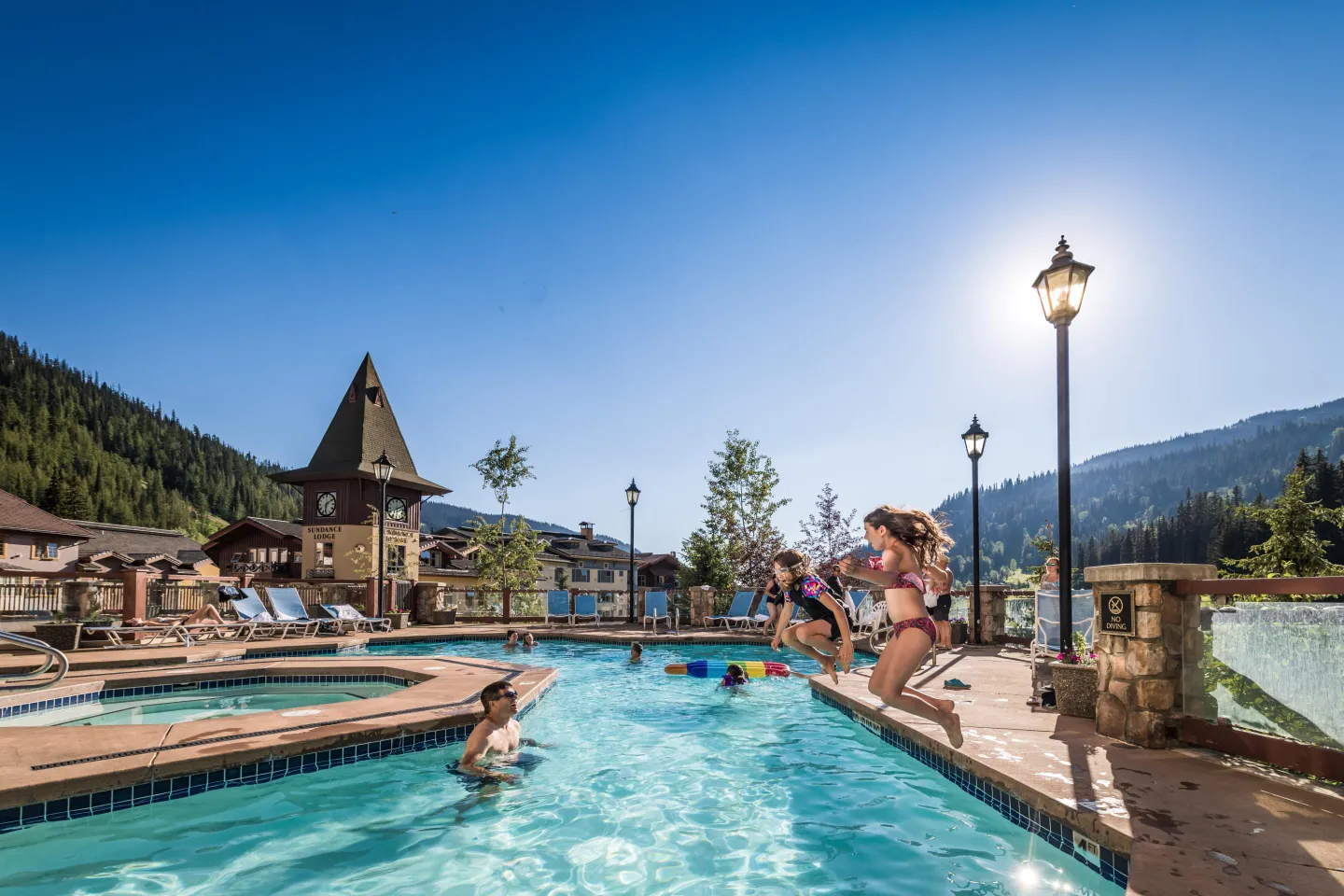 Family in outdoor pool