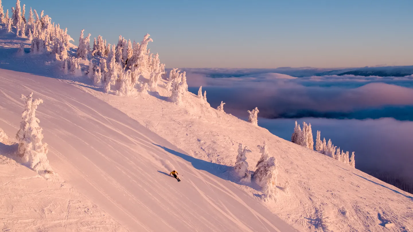 Skier on groomoed run