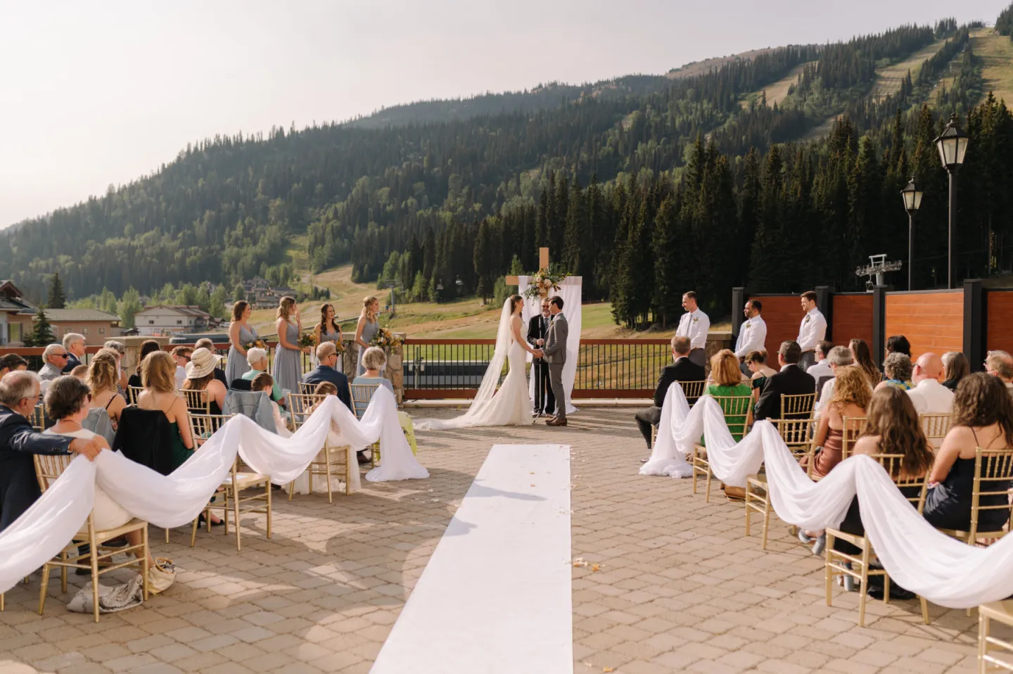 Bride and Groom at the alter on the terrace with mountain views