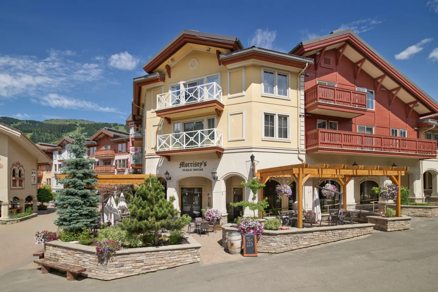 View of Morrisey's patio from outside with mountain views in the background