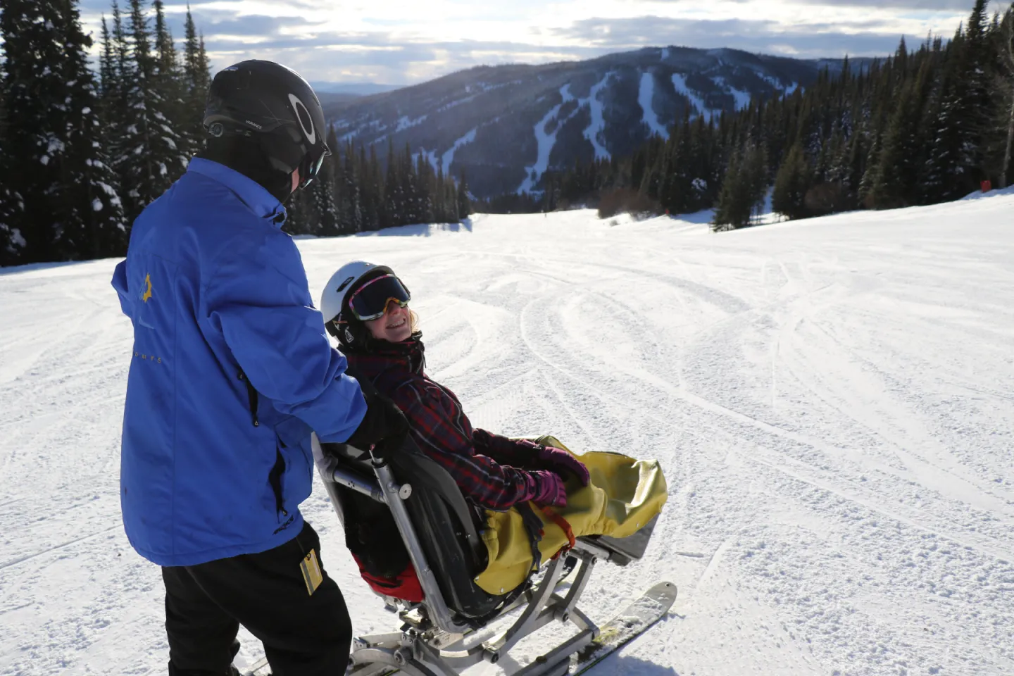 Snow Limo and Guide standing on the mountain with mountain views