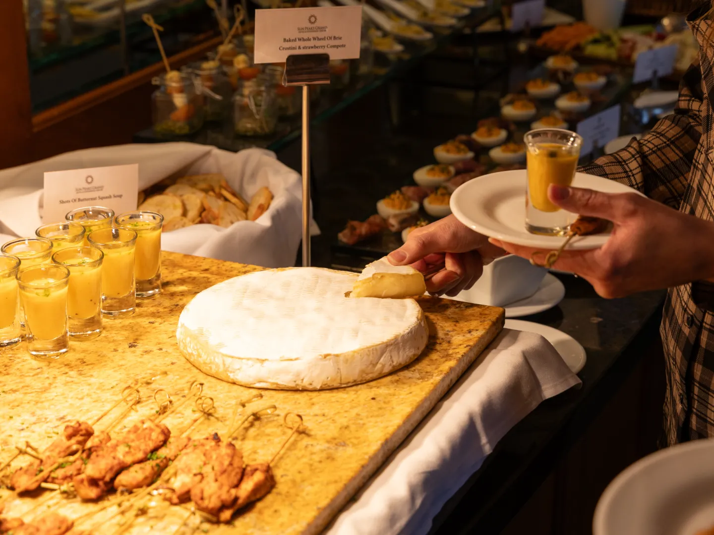 Apres platter with someone grabbing food