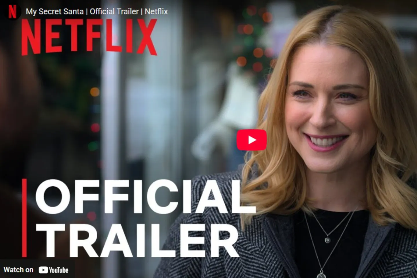Smiling woman in Netflix trailer thumbnail.